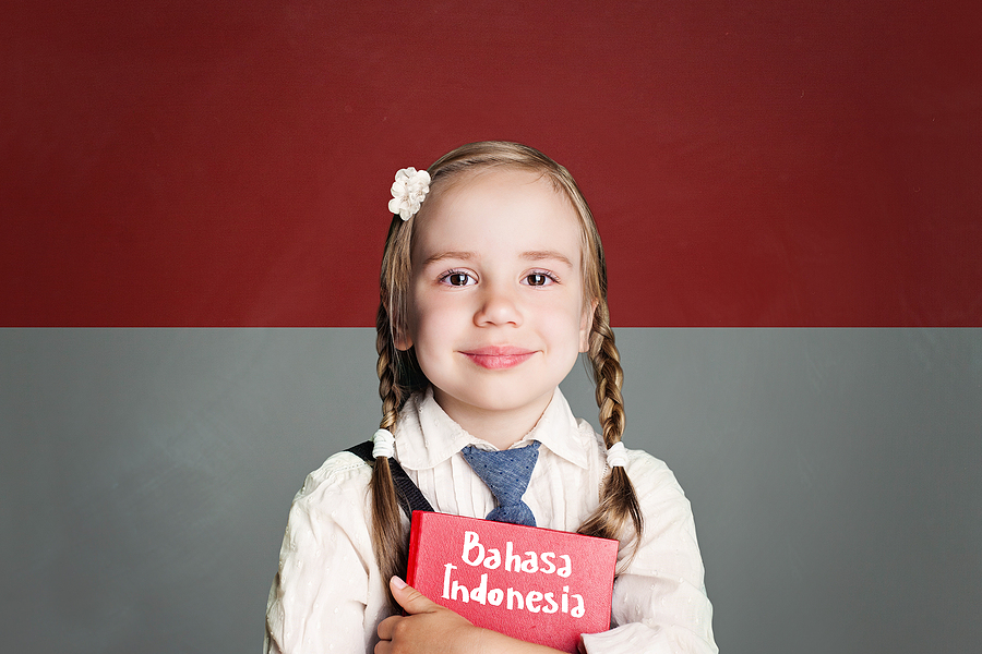 Indonesia Concept With Kid Little Girl Student With Red Book Aga