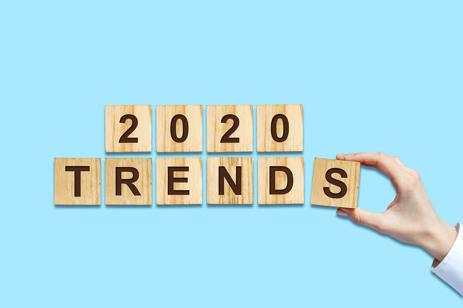 2020. Trends. Female Hand Makes Up Words From Wooden Blocks. Iso